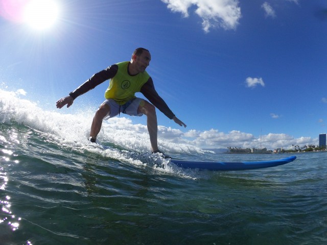 A man riding a wave. Provided by Polu Lani Surf.